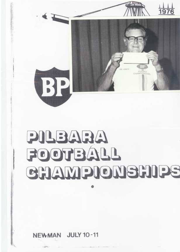 Colin Matheson holding a cheque for $3,000 from BP