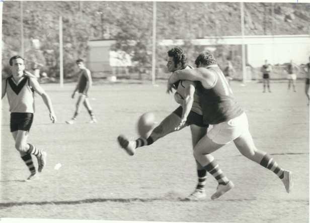 Johnny Mitchell, Goldsworthy, watches a tackle by Finucane Island player.